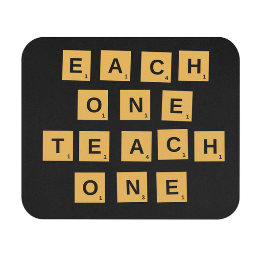 mouse pad, reads each one teach one with brown block letters