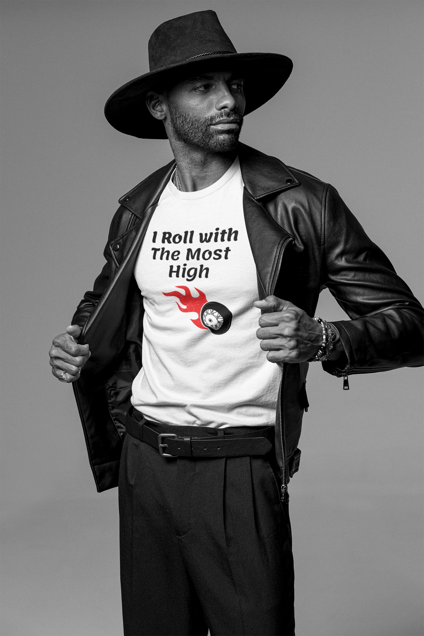 man with leather bikers jacket and western hat holding open his jacket showing white tee with graphic of a wheel with fire coming from it, tee reads " I run with the Most High"I Roll with the Most High Christian tshirt, skate lovers gift, Religious graphic tee, Roller skating gift, motivational exercise shirt, Jesus tshirt .*See Matching Mug,