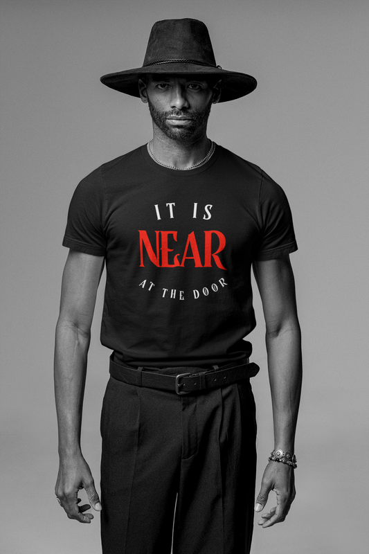 man wearing a hat and a black tee with red and white letters which reads-It is Near-At The Door! Christian end times t-shirt, Revelations tee, Apocalypse tshirt, Jesus second coming tee gift, Bible gift, Christian gift,