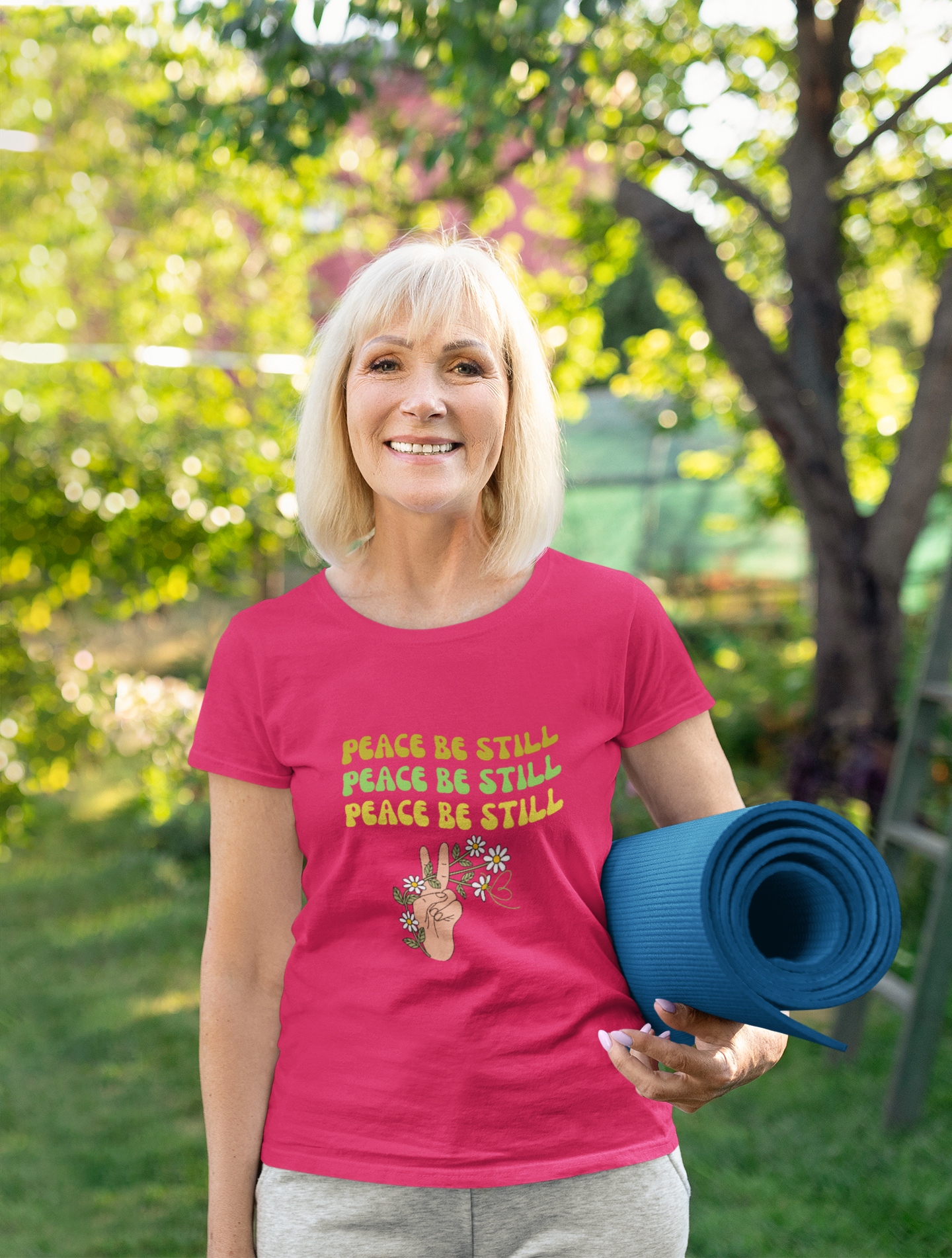 smiling woman holding exercise mat and wearing tee that reads-Peace be Still -Christian tee gift, Peace tee, peace sign tshirt, Religious tshirt for women, Bible gift, Jesus peace tshirt,