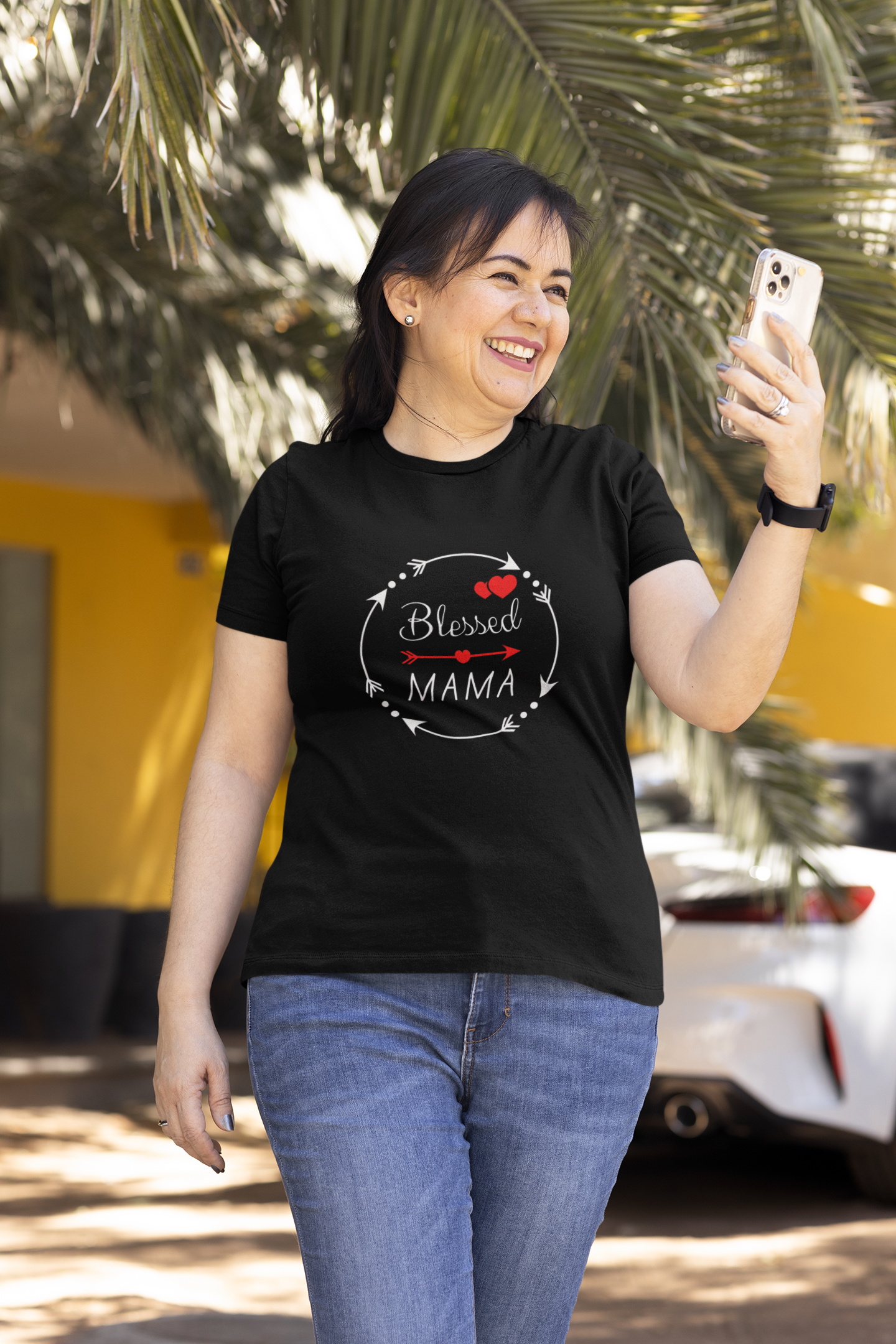 woman wearing black tee with white letters and red heart that reads -Blessed Mama tee inspirational gift for mom, religious women's tshirt, gift for wife, self care tee, Bible tee, Jesus shirt, **See matching mug, mousepad and tote bag, Christian gift tee for mother's day.