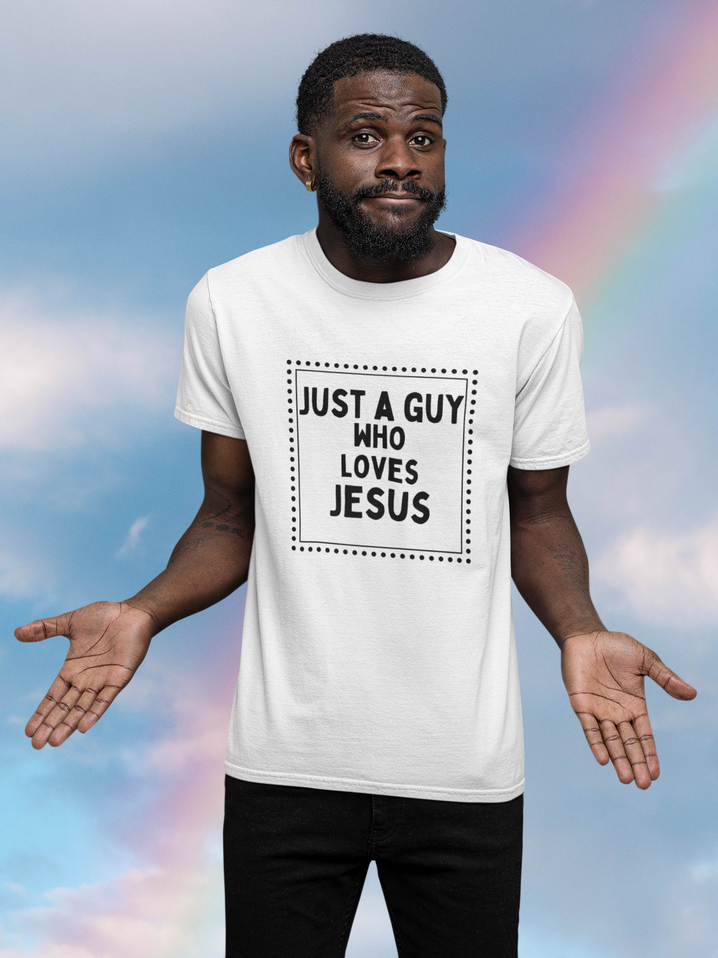 man standing with hands outward with clouds and rainbow in background wearing tee that reads-Just a guy who loves Jesus Christian tshirt, Jesus tee, Religious men's t-shirt, men's faith tshirt, motivational tshirt, love tee, Bible tee gift, fathers day gift, gift for son or brother,***See Matching Mug,