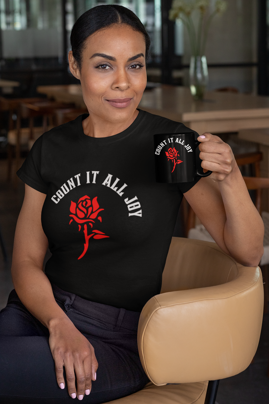 woman sitting in chair holding a matching mug wearing black tee with red rose and has Bible verse "Count it all Joy- Christian women's tshirt, Bible scripture shirt, Religious gift tee, inspirational tshirt, faith t-shirt,**See Matching Mug,