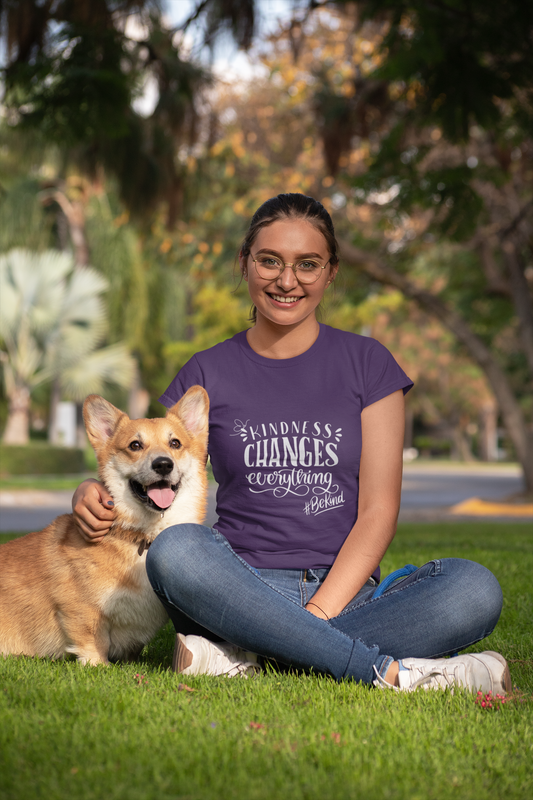 smiling woman sitting on grass with dog,, wearing tee that reads-Kindness changes everything Inspirational tshirt, anti bullying tee, self care tshirt, mental health tshirt, motivational tshirt for women, gift for mom, teacher gift, family tee, be kind tee,