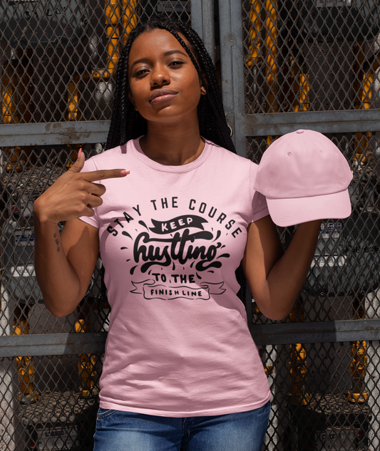 woman pointing to her shirt which reads-Stay the course, keep hustling to the finish line-Religious t-shirt, Christian gift, Bible tee, motivational Christian tee gift, gift for teacher, Pastor gift, Church gift, Jesus tee, family shirt for Christians, Israelite clothing, Hebrew shirt,*** See matching mug.