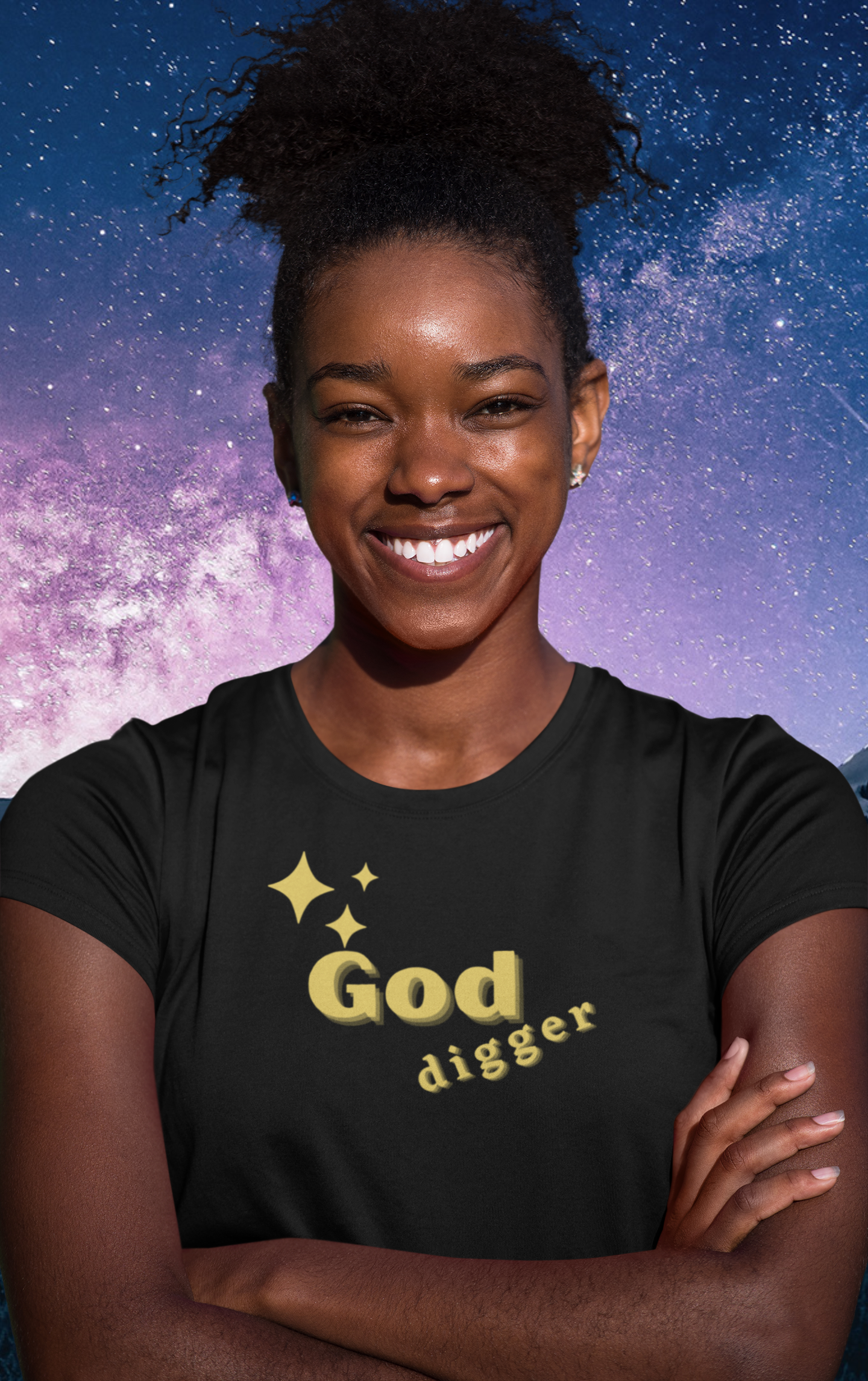 woman standing in front of a starry sky  with black tee with gold letters reading "God Digger",  proclaiming that she digs God more than gold and riches, stars on tee as well, gift for sister, mom, student, friend, wife, self, ***See matching Tote and Notebook