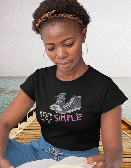 woman sitting and wearing tee with sneakers on tee that reads-Keep Life Simple tshirt, inspirational tshirt, motivational graphic tee, self care tee, mental health awareness tshirt, gift for nurses week, pastor gift, worship leader gift, gift for teacher, 